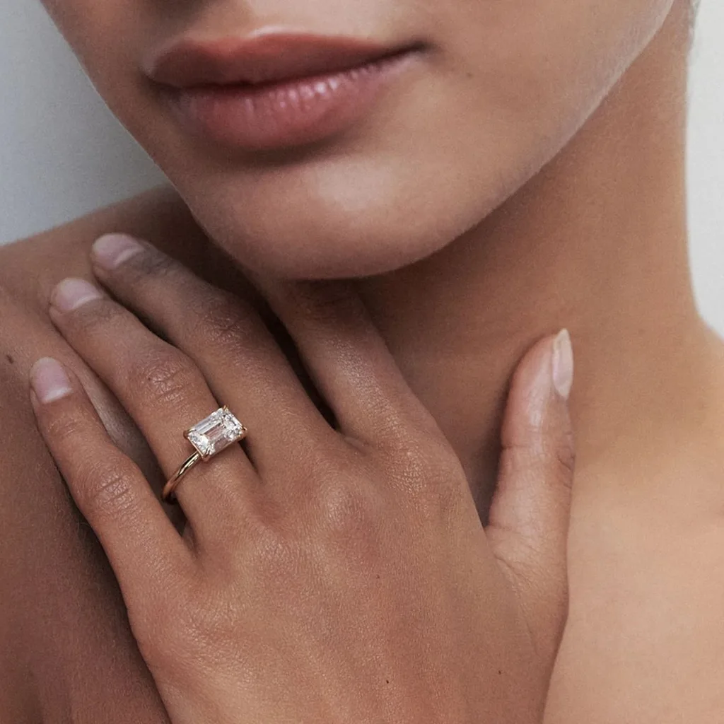 Kate and Kole emerald cut east-west engagement ring