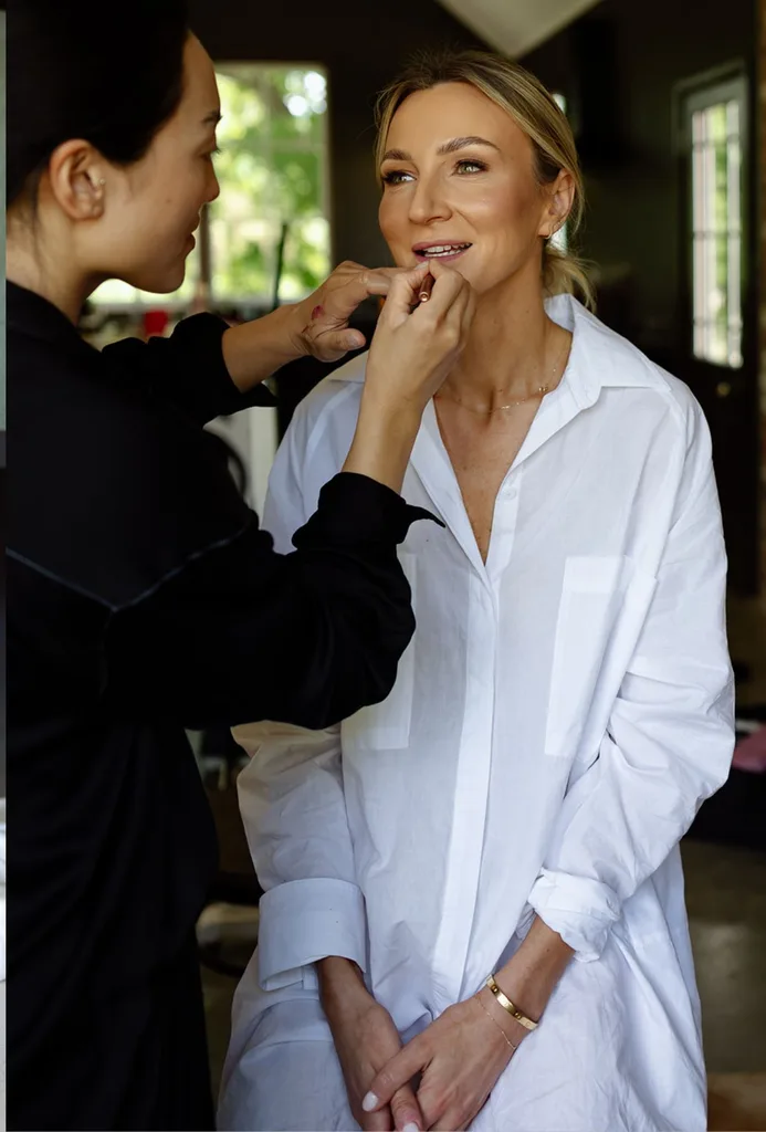 Eliza Sykes having her makeup done for her wedding