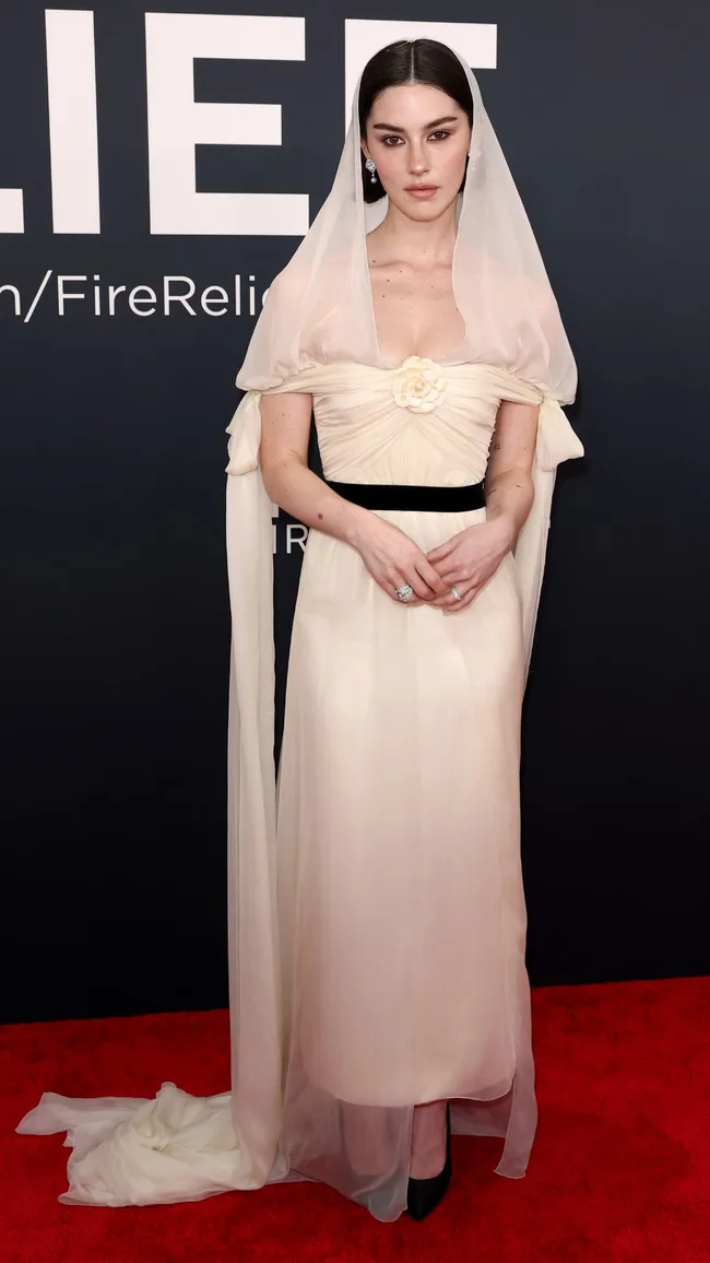 grammys red carpet 2025 gracie abrams wears a vintage white tea-length dress with sheer head veil