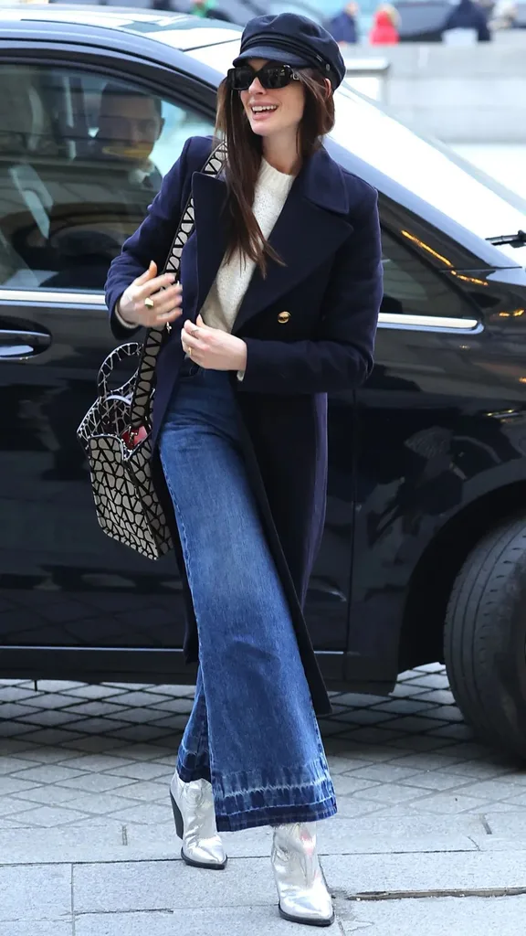 Anne Hathaway wearing a baker boy cap