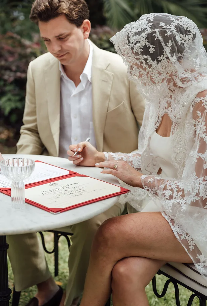 Molly and Dean signing their paperwork