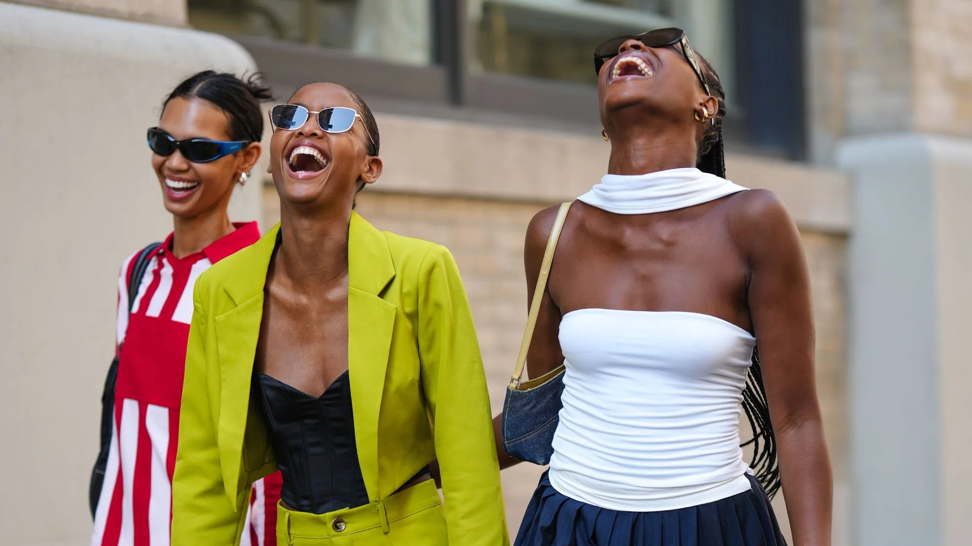 Three women laughing and smiling