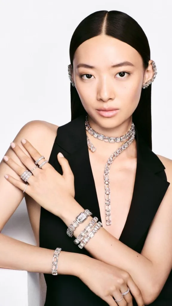 Model wearing swarovski crystal jewellery and black top