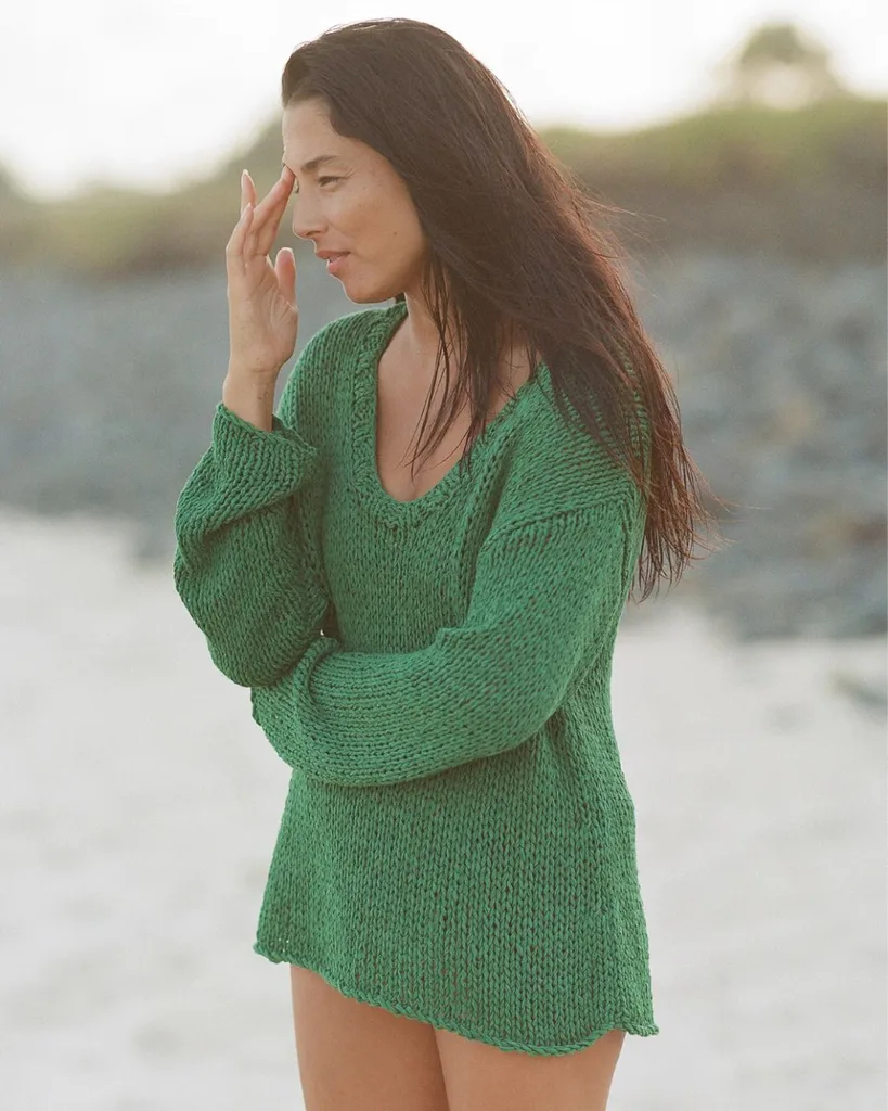 Jessica Gnomes wearing a green zulu & zephyr knit jumper