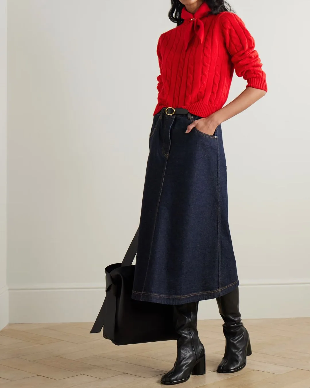model wearing red &daughter knit top with long denim skirt 