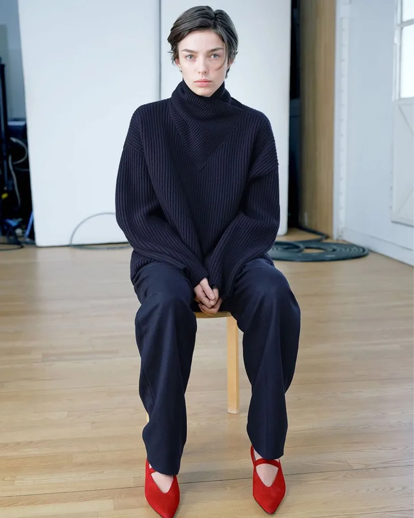 Model wearing grey totem jumper