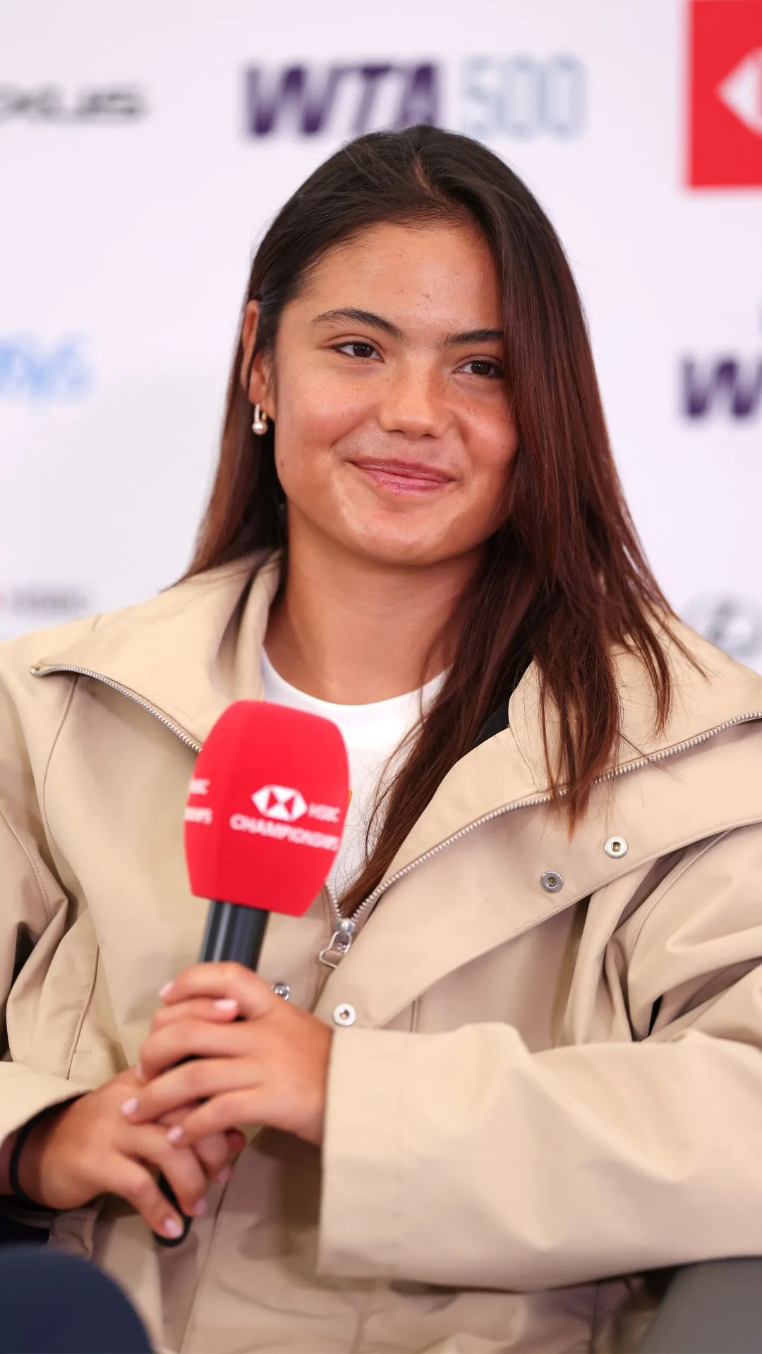 Emma Raducanu of Great Britain talks to the media during a practice day prior to The HSBC Championships at The Queen's Club on June 08, 2025 in London, England. 