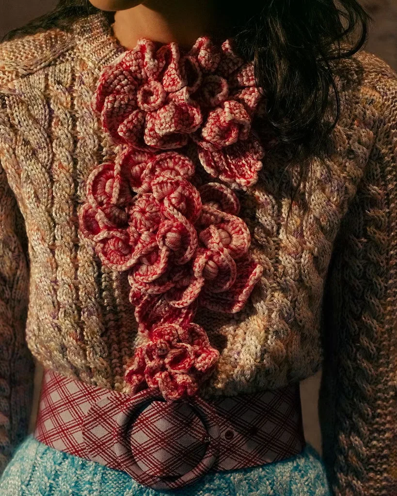 Close up photo of a knitted top from the Louis Vuitton Cruise documentary