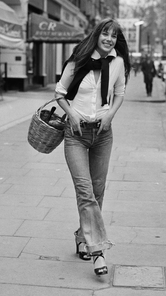 Jane Birkin wearing jeans, white shirt and basket bag