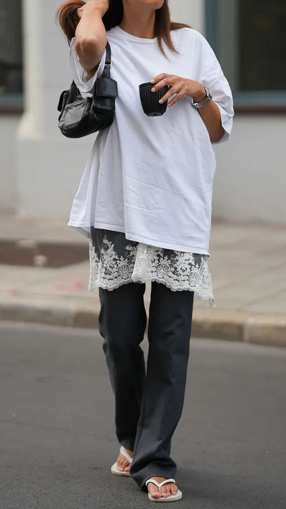 girl wearing oversized white tshirt with slip underneath it and thongs