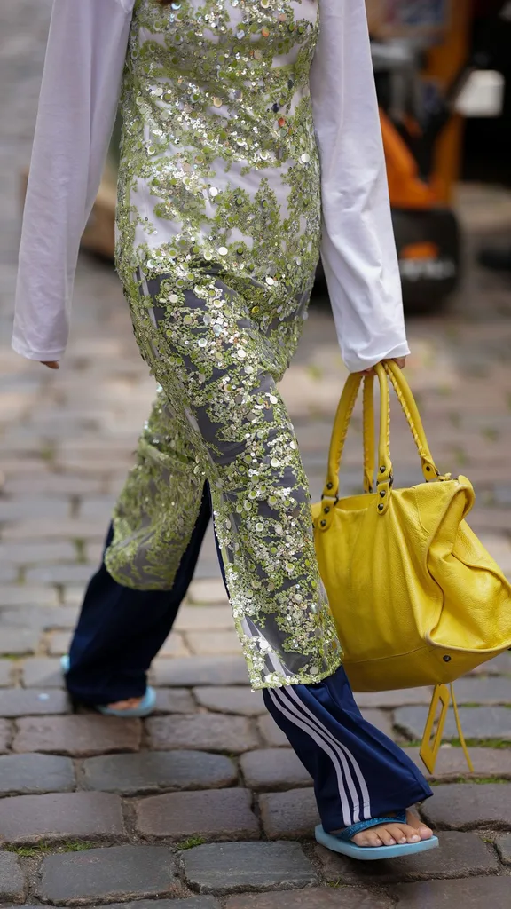 Girl wearing layers with thongs and a balenciaga city bag