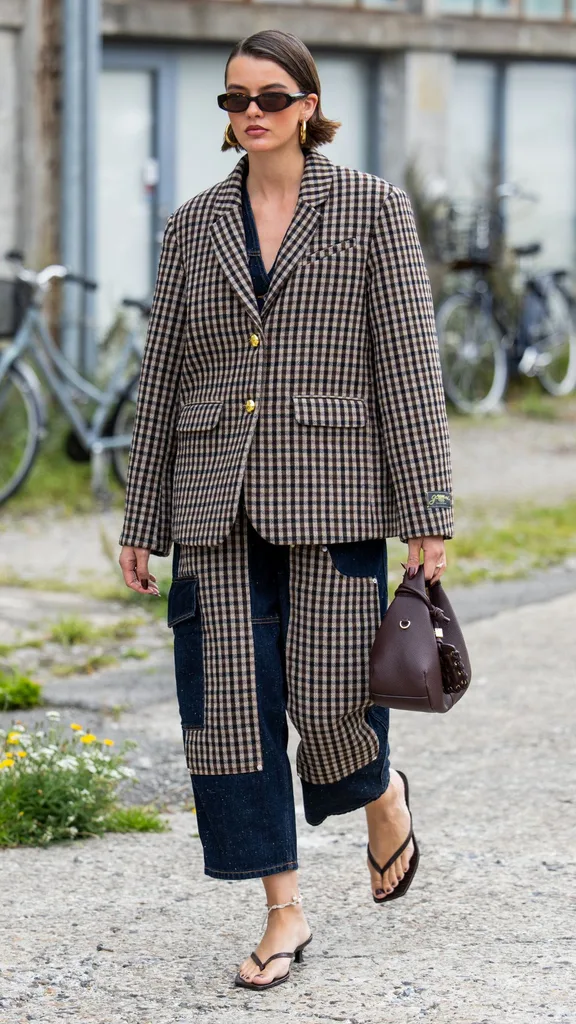 girl styling thongs with a suit