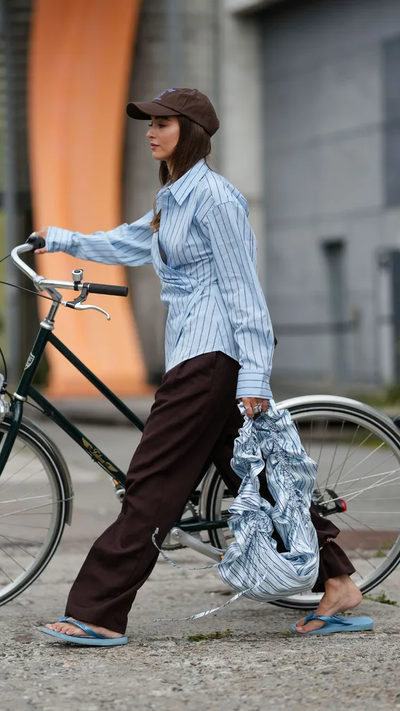 girl wearing a business shirt with pants and thongs