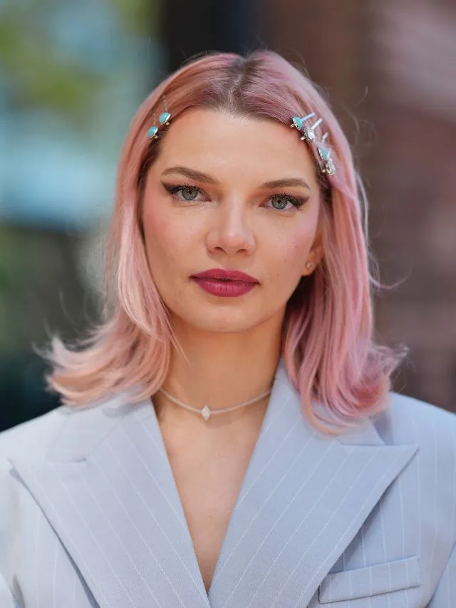 New York fashion week attendee with pink hair and a kick bob