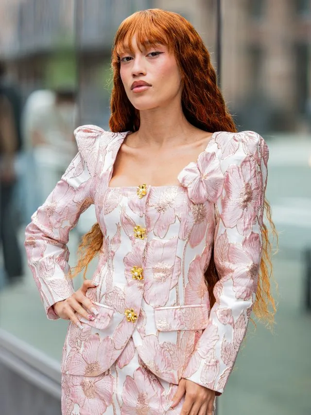 New York fashion week attendee with long copper hair worn in a ripple style 