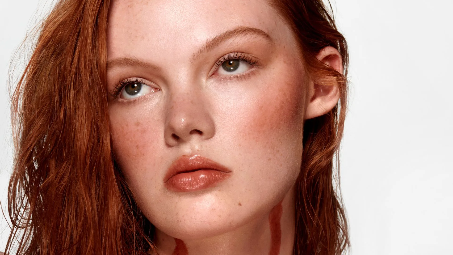 Red headed model in Haus Labs campaign