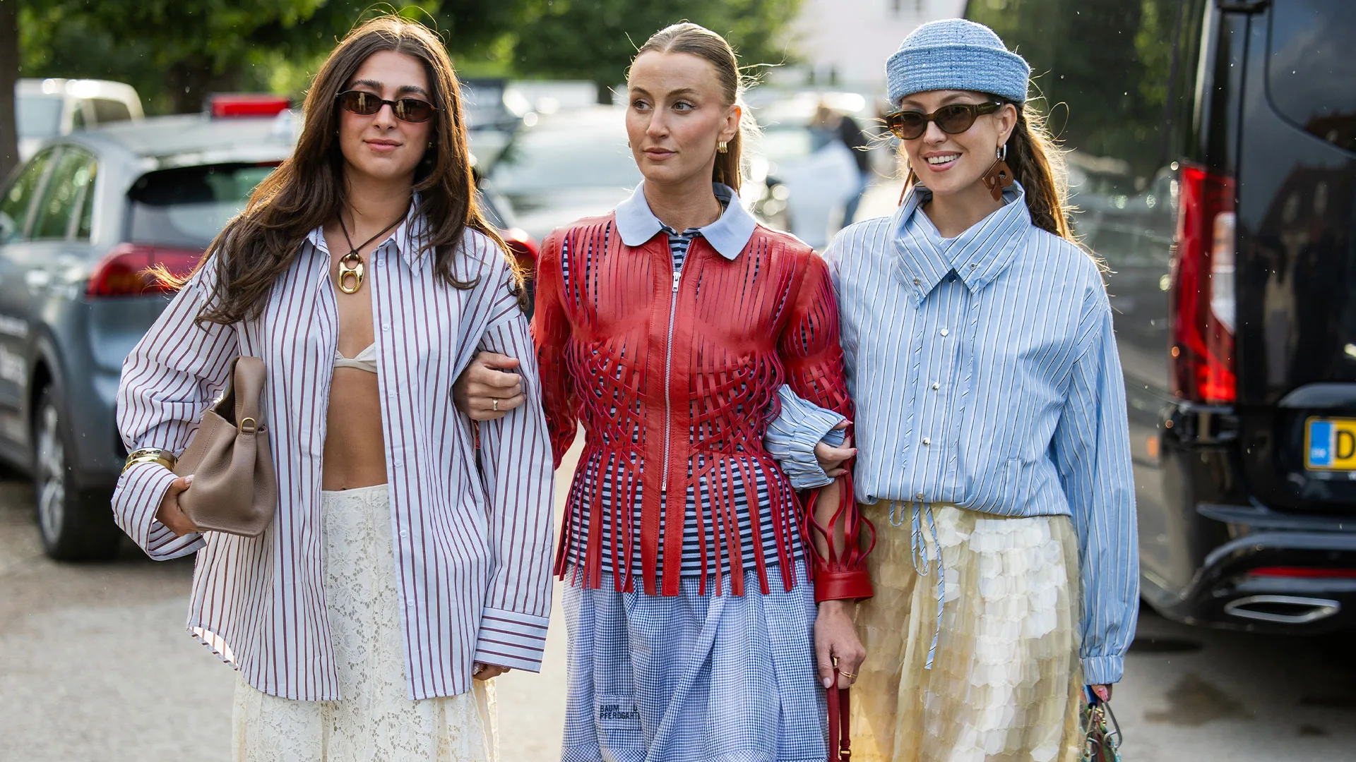 Three women in a street style photo