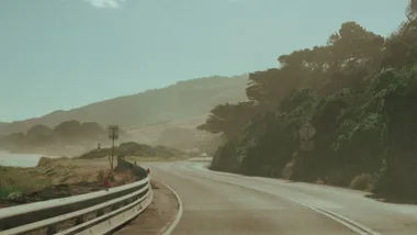 Nostalgic looking image of car on coastal road