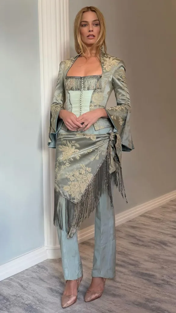 Image Margot Robbie wearing a vintage Jean Paul Gaultier top with jeans to an interview