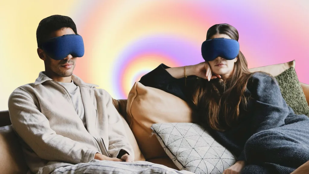 A couple sitting together wearing the lumenate nova.