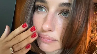 Devon Lee Carlson showcases her three stone engagement ring from Fiance Duke Nicholson