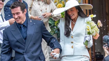 Dua Lipa wearing a custom Schiaparelli suit while wedding actor Callum Turner in London