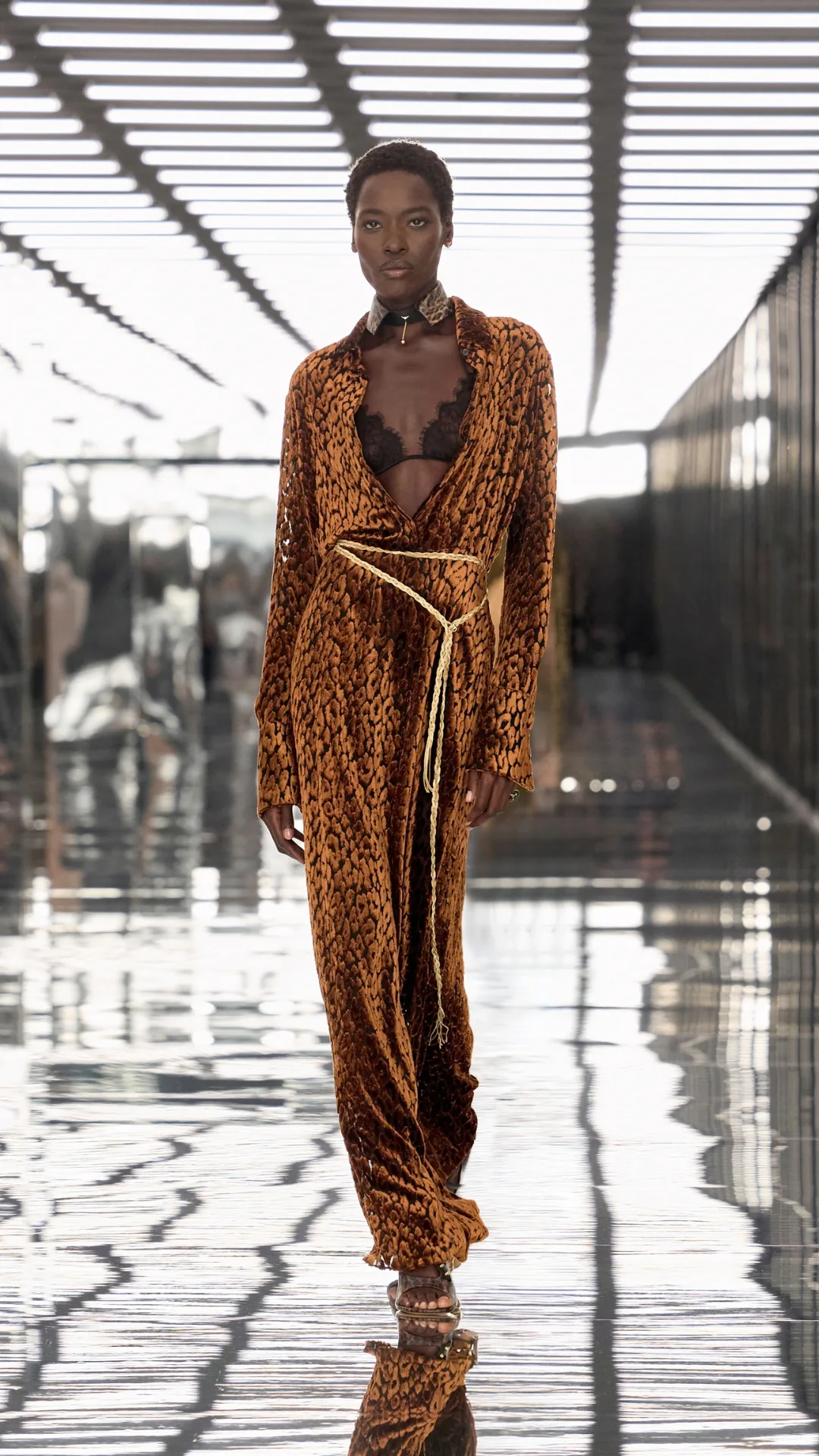 Model in an orange maxi dress