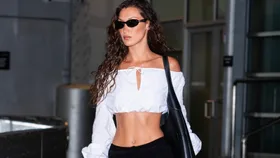 Bella Hadid carries an oversized large black leather tote bag
