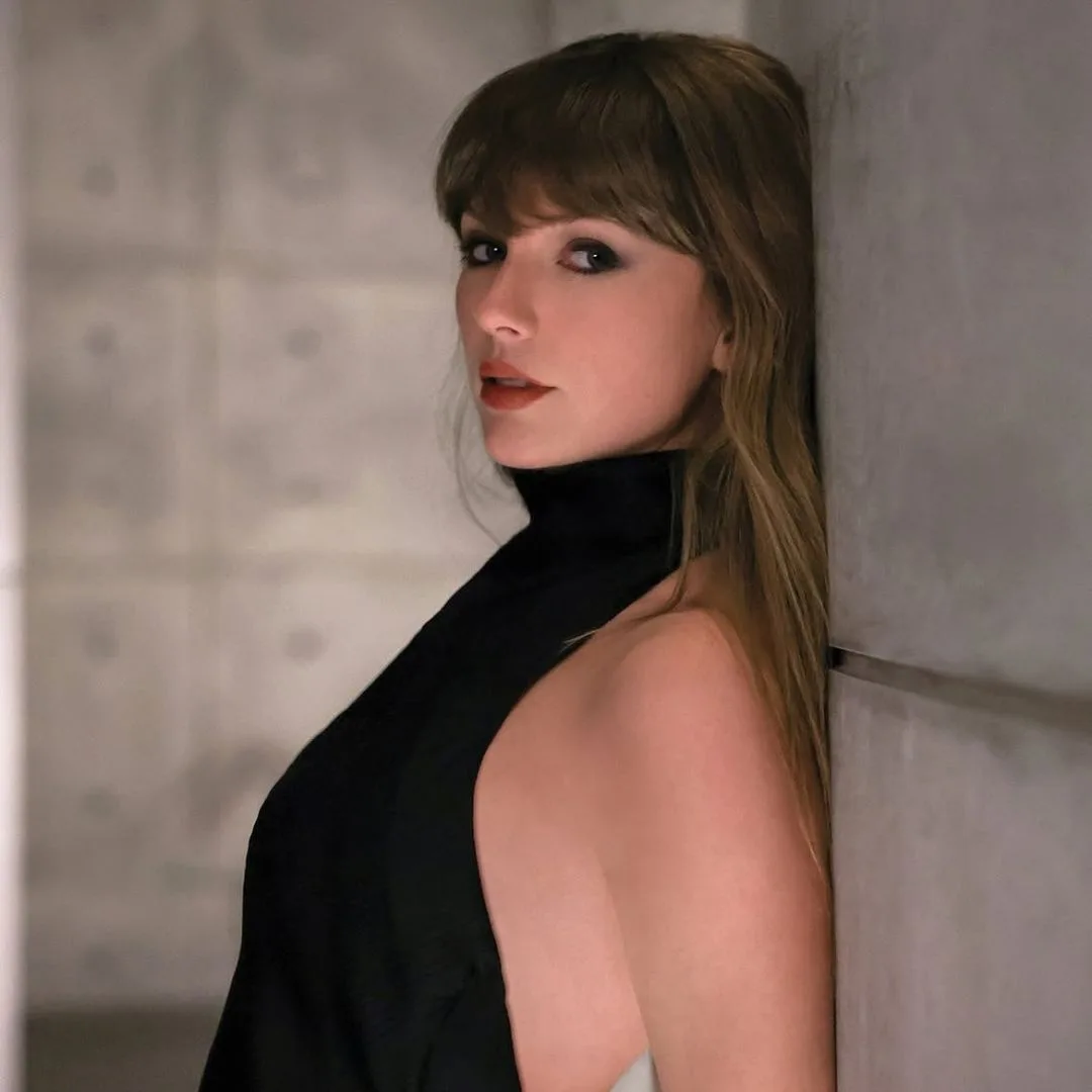 Taylor Swift wearing a black Khaite halterneck dress on the album artwork for Patient Zero 