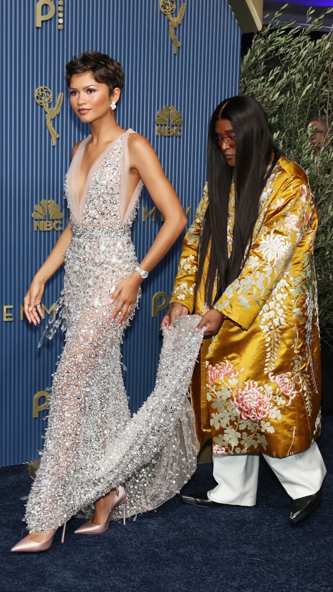 Zendaya Emmy Awards with Law Roach carrying her train 