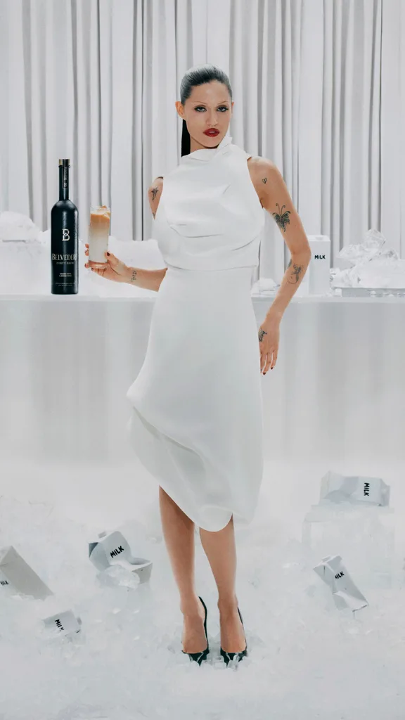 Gabbriette in a white dress