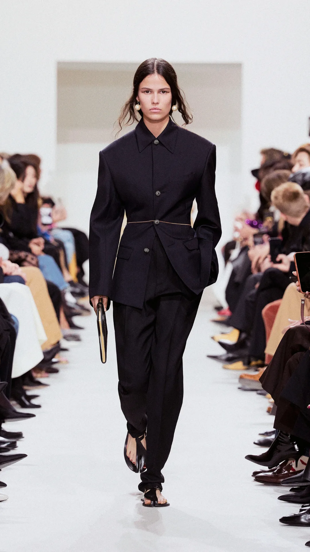 A model wearing a black suit