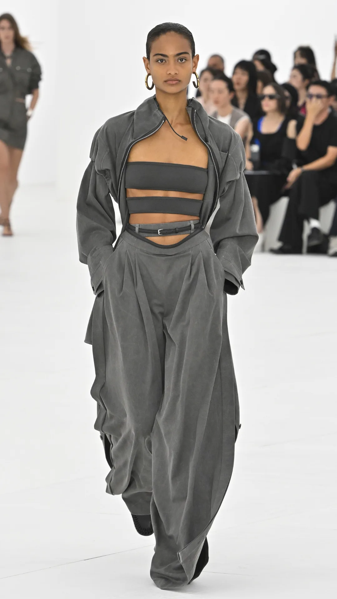 A model wearing a grey outfit
