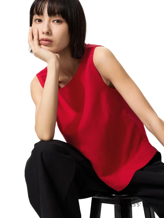 A model wearing a red singlet
