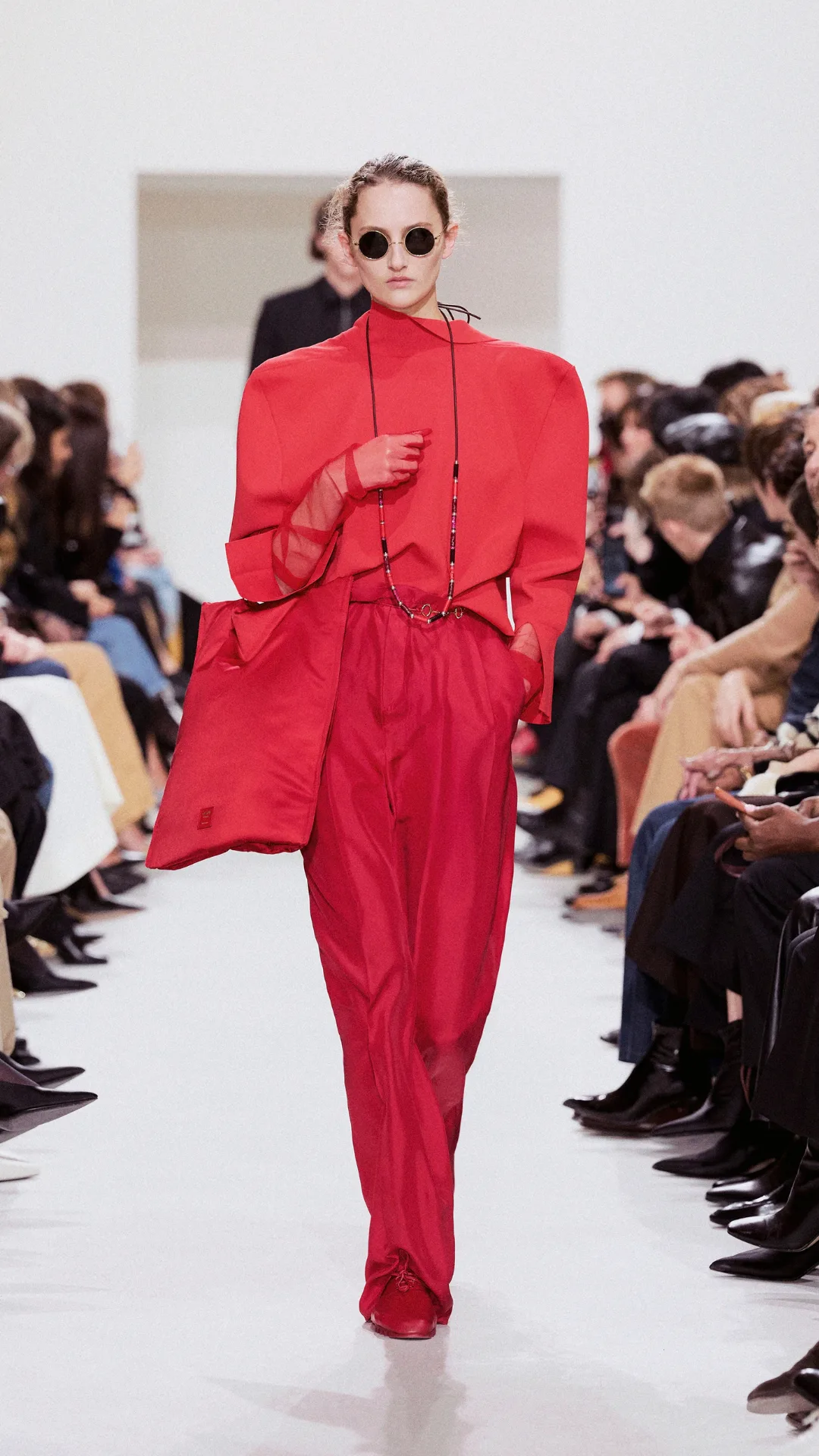 A model wearing a red top and pants