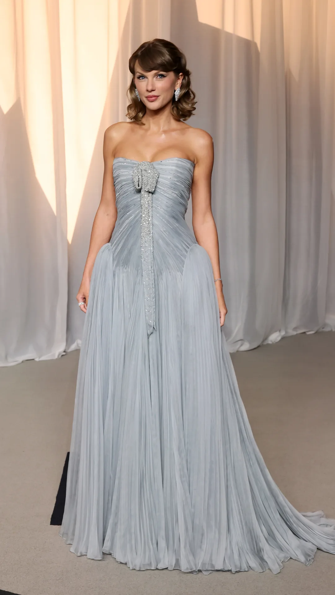 Taylor Swift wearing a blue dress.