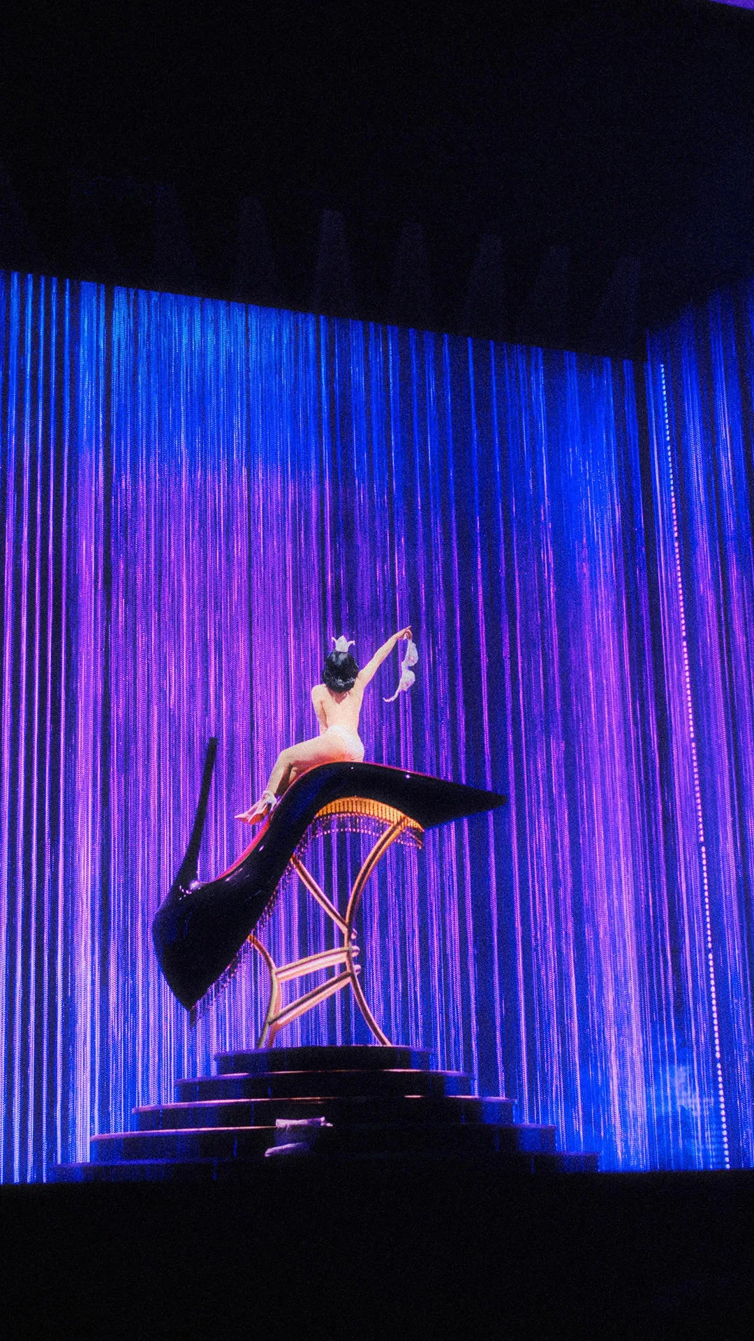 A still from the Louboutin show starring Dita Von Teese