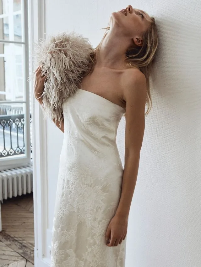 Model wears a strapless wool silk jacquard dress from St Agni bridal collection 2027