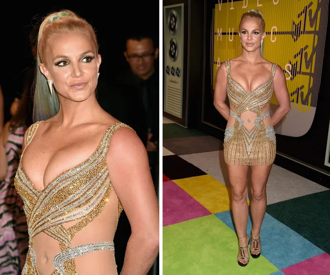 Singer in a sparkling gold mini dress with crystal details, posing at a music awards event.