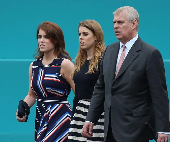 Three adults walking side by side; two women in dresses and a man in a suit against a teal background.