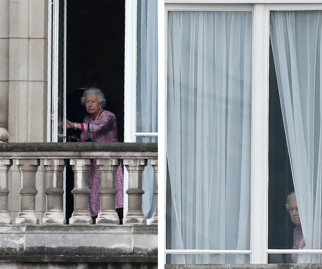 Older woman in a purple dress seen at a balcony and peeking behind sheer curtains in a building's window.