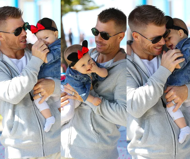 A man in sunglasses holds a baby wearing a Minnie Mouse headband with a red bow in multiple playful poses.