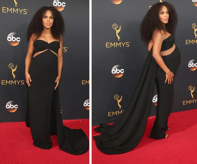 A woman in a black gown poses on the red carpet at the Emmys, showcasing her pregnancy.