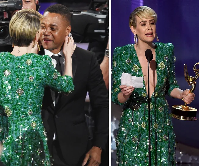 Ceremony attendees embrace, and a woman in a green dress holds an award on stage.