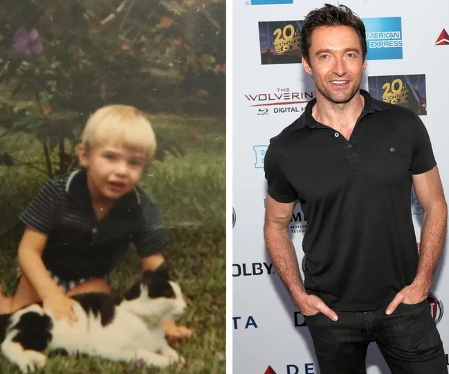 Young boy with cat on left; man in black shirt on right at a movie event backdrop.
