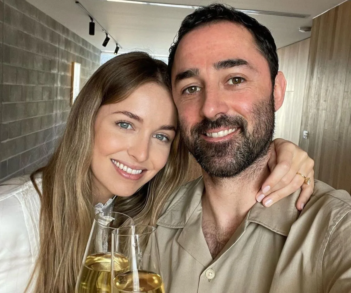 Andy Allen with his wife and a glass of wine