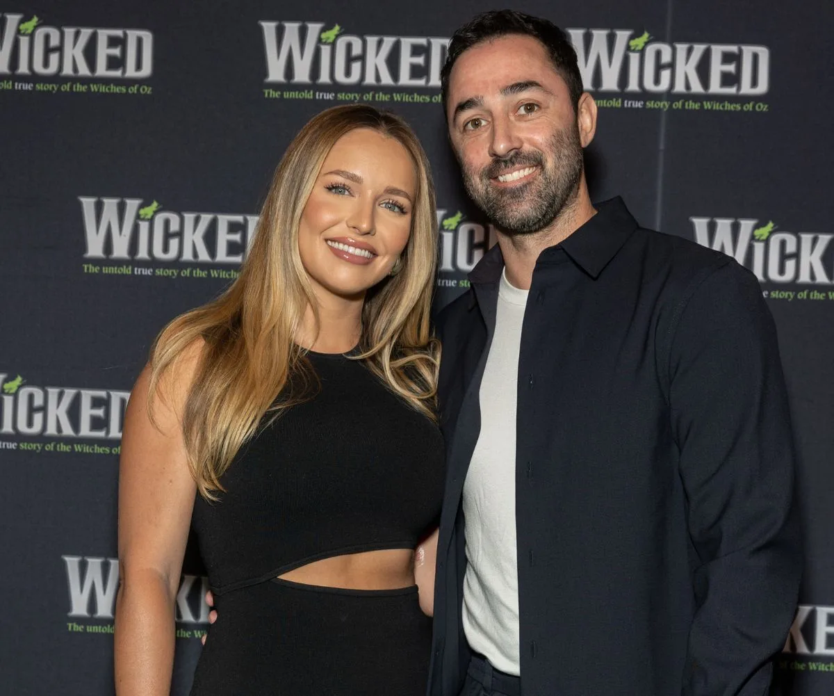 Andy Allen with his wife at a red carpet event