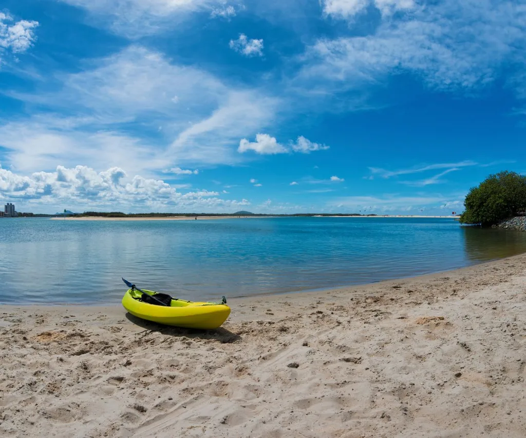 a yellow kayak in front of the Maroochy River