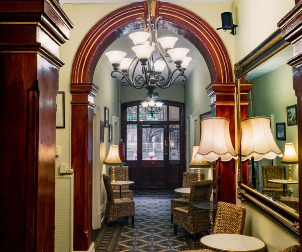 an arched doorway with period details in the Nunnery, a quirky budget-friendly Melbourne stay