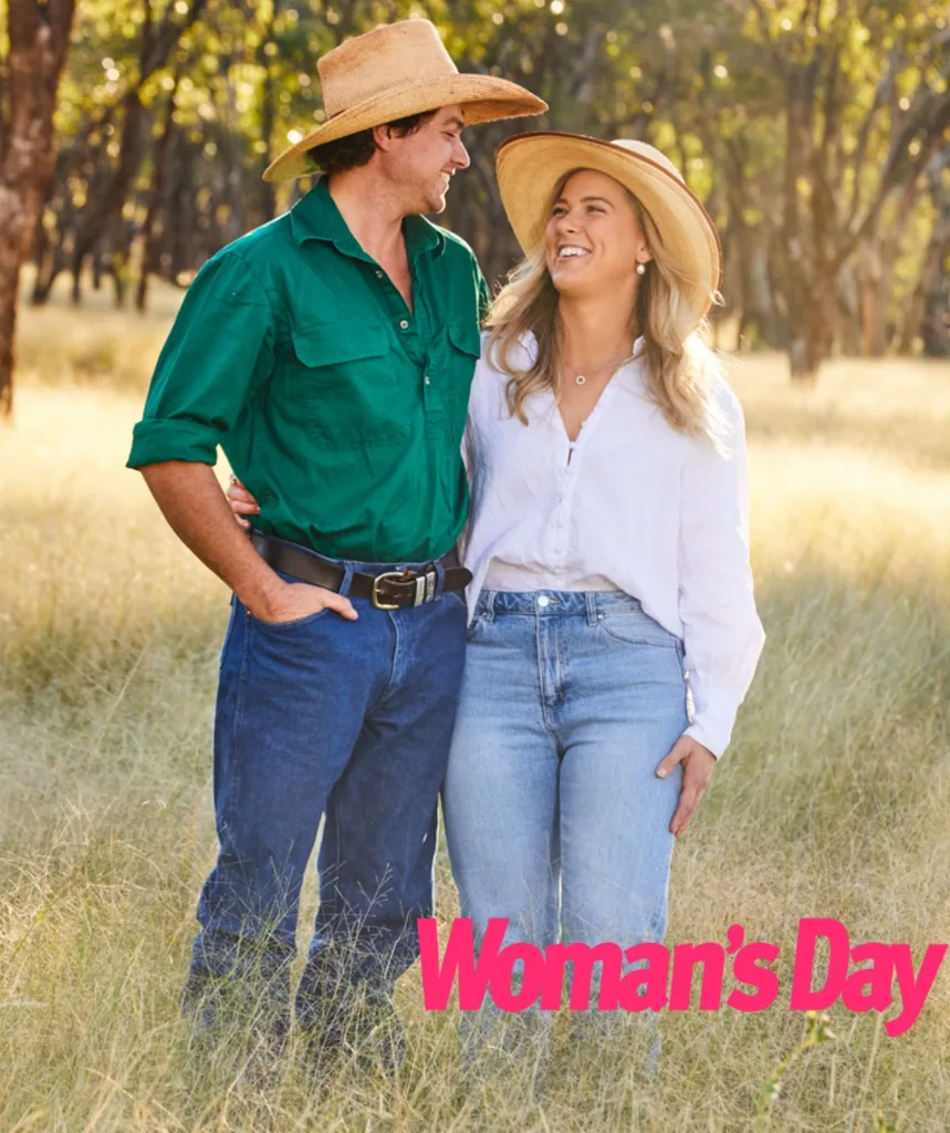 FWAW Dustin and Sophie smile looking at each other, wearing straw hats and button up shirts - his green, hers white